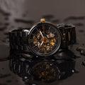 Franklord Mechanis Eclipse Noir Automatic Skeleton Watch displayed in water-resistant environment with water droplets reflecting its durability.