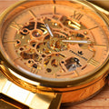 Intricate gold skeleton dial of the Franklord Mechanis Regal Gold Watch, highlighting its luxurious design and visible mechanical movement.