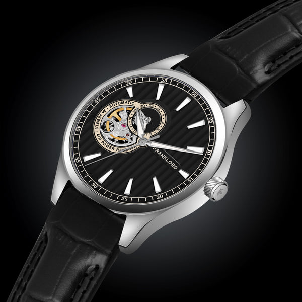 Side view of Regal Sapphire Mechanic's Eye - Ebony Luxe, showcasing its polished stainless steel case and bold black textured dial.